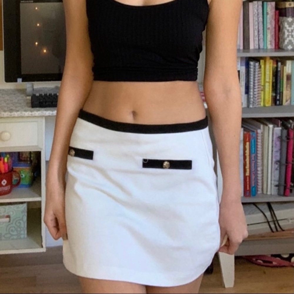 White skirt with gold buttons